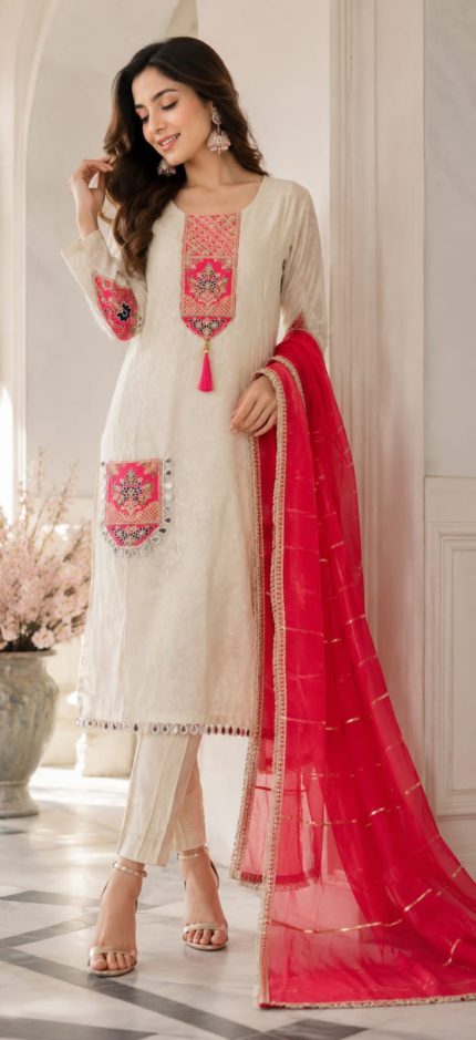 Grace meets tradition in this beautiful ethnic suit, adorned with intricate pink embroidered detailing on the neckline, sleeves, and hem. paired with a vibrant pink dupatta featuring delicate golden accents, the ensemble exudes sophistication and charm. Perfect for festive celebrations, family gathering and special occation.